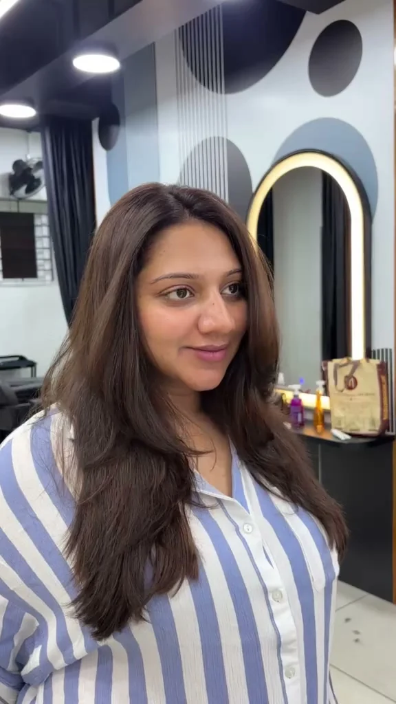 Front three-quarter view of long layered hair at RAM KALASAPATI